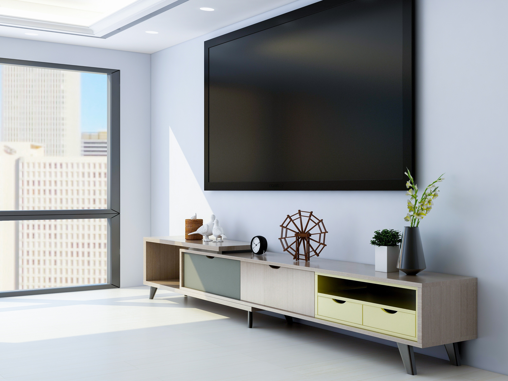 TV and TV cabinet in modern living room, there are many decorations on TV cabinet